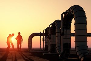EP2C Energy – Oil workers checking oil pump