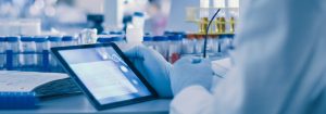 Image of a scientist with a tablet - EP2C Life Sciences